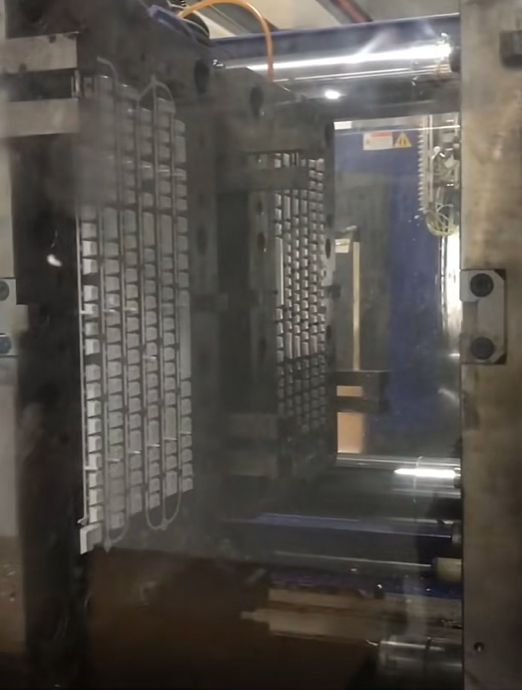Multi-cavity mold for custom double shot keycaps with molded legends and cross-shaped mounting stems